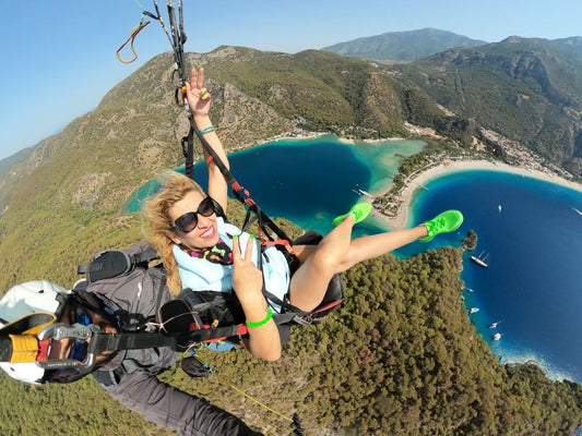 Tandem paragliding over Ölüdeniz turquoise lagoon
