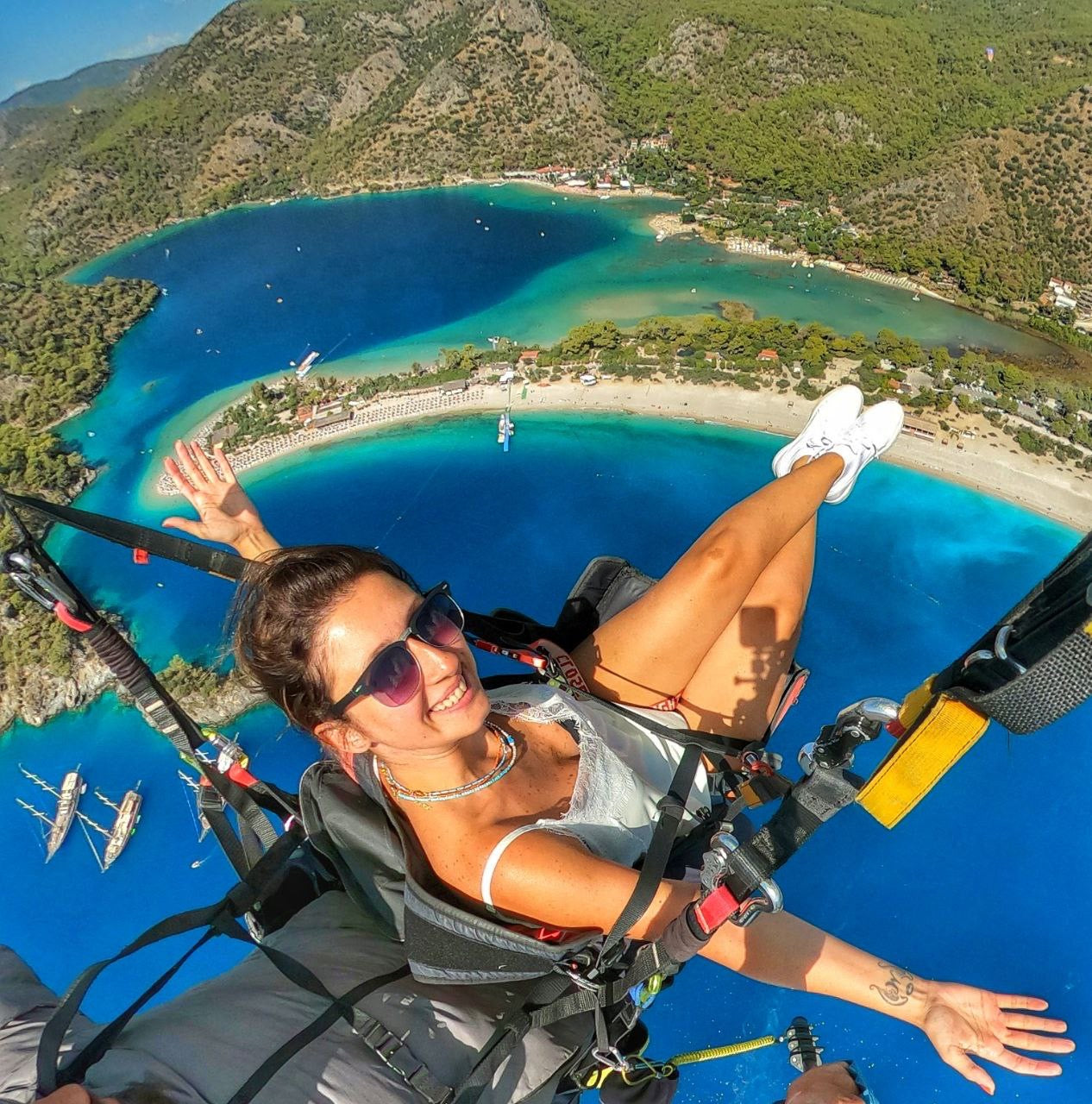 Fethiye paragliding flight above blue lagoon and pine hills